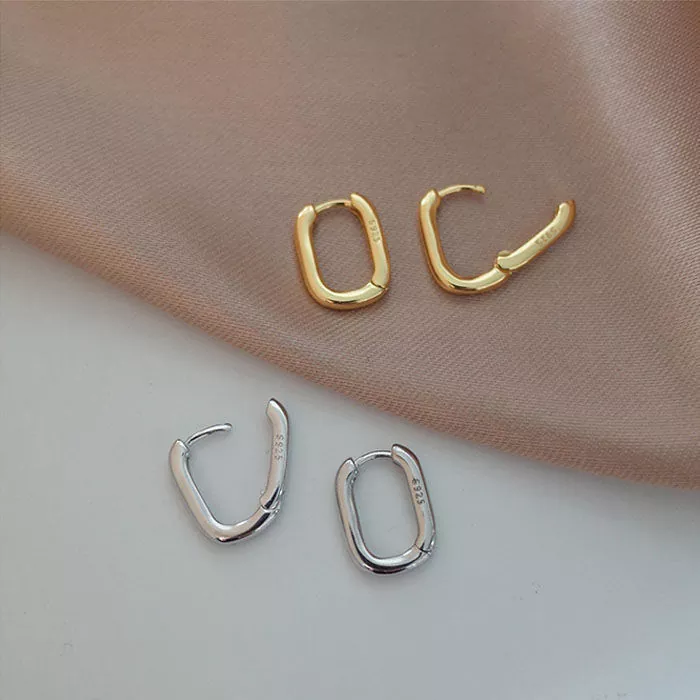 Minimalist oval hoop earrings in gold and silver, crafted from 316L stainless steel, displayed on a neutral backdrop with product highlights for wholesale buyers – yanluojewelry.
