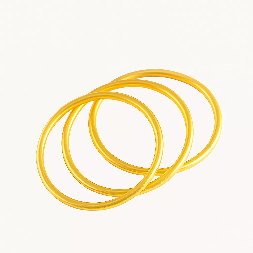 Three classic gold stainless steel bangles arranged in an overlapping layout on a white background, ideal for wholesale jewelry buyers and stainless steel jewelry suppliers.
