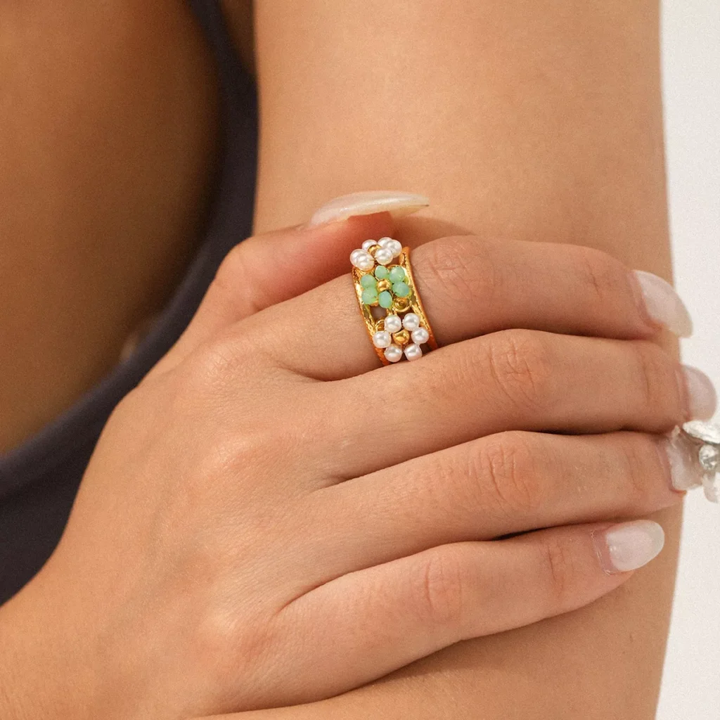 Gold stainless steel ring with green gemstone and pearl inlay, elegant wholesale jewelry by Yanluo Jewelry