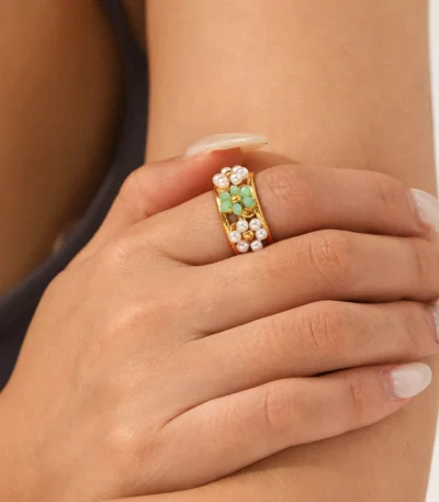 Gold stainless steel ring with green gemstone and pearl inlay, elegant wholesale jewelry by Yanluo Jewelry