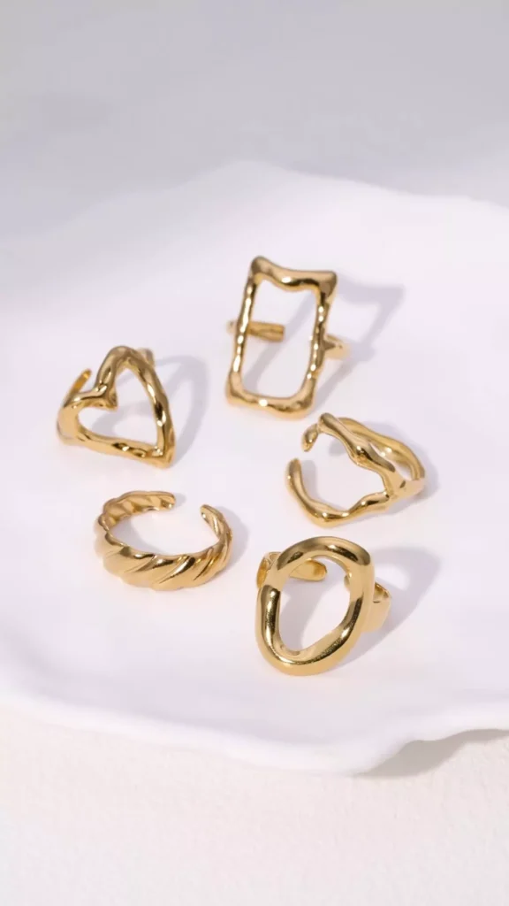 Minimalist gold stainless steel rings collection with geometric and abstract designs, wholesale jewelry by Yanluo Jewelry