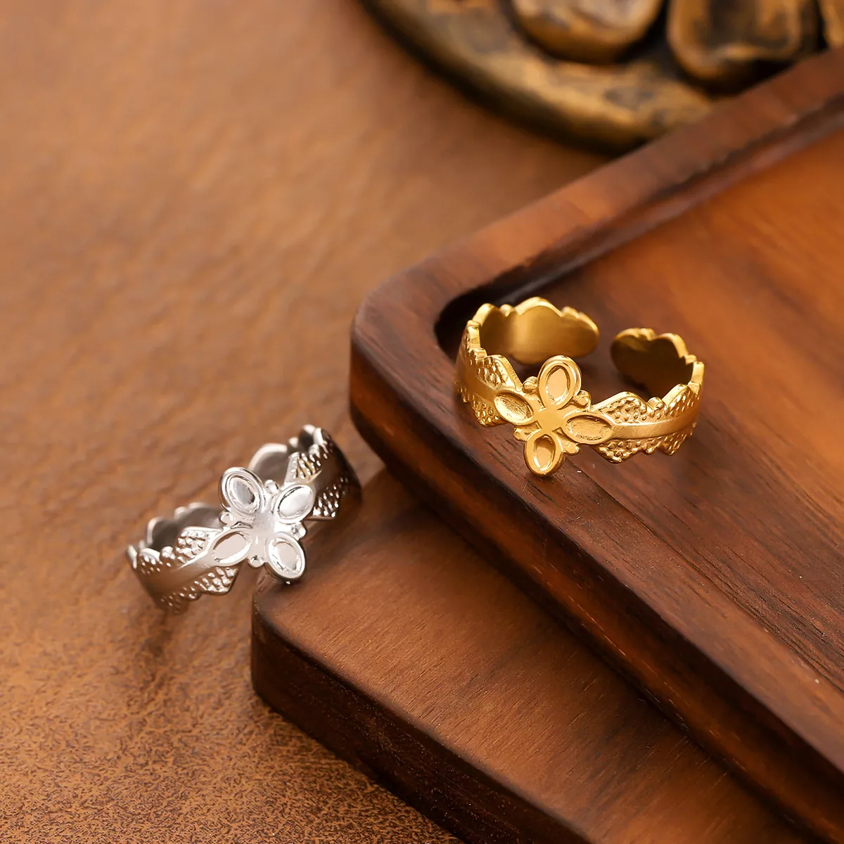 Gold and silver floral pattern stainless steel rings with openwork design, wholesale jewelry collection by Yanluo Jewelry