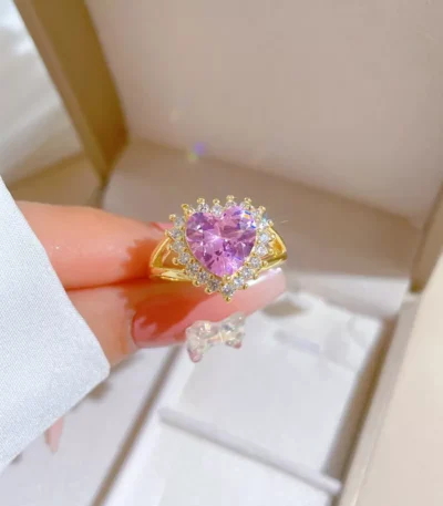 Gold stainless steel ring with pink heart-shaped stone and zirconia halo, wholesale jewelry by Yanluo Jewelry.