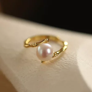 Gold stainless steel pearl ring with bamboo-textured band, elegant wholesale jewelry by Yanluo Jewelry