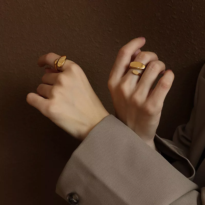Minimalist gold stainless steel rings worn on hand, modern open-band design, wholesale jewelry collection by Yanluo Jewelry
