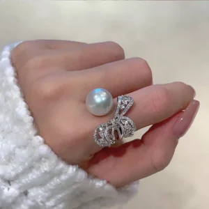 Elegant stainless steel ring with large pearl and zircon bow design, wholesale jewelry by Yanluo Jewelry
