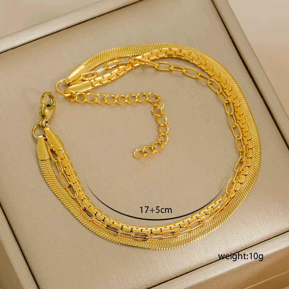 A stylish multi-layer bracelet crafted from gold-plated stainless steel, featuring a combination of link, snake, and curb chain designs, perfect for wholesale fashion jewelry collections.