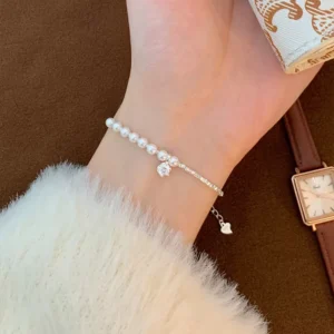 Elegant stainless steel charm bracelet with pearls and crystal pendant for wholesale buyers