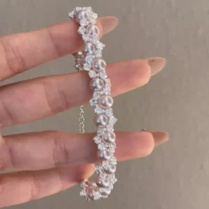 Elegant pearl and zircon inlaid stainless steel bracelet, luxury fashion jewelry from a reliable stainless steel jewelry wholesale supplier