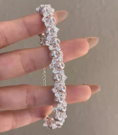 Elegant pearl and zircon inlaid stainless steel bracelet, luxury fashion jewelry from a reliable stainless steel jewelry wholesale supplier