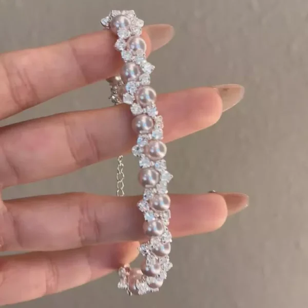 Elegant pearl and zircon inlaid stainless steel bracelet, luxury fashion jewelry from a reliable stainless steel jewelry wholesale supplier